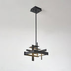 A compact matte black Clérachic pendant with a square canopy and a single rod shows its crossed flat bars against a pale grey wall.