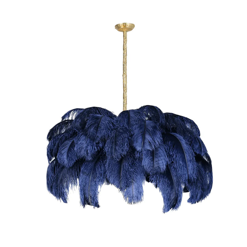Navy feathers hang in deep, soft layers from the brass stem of this Clérachic chandelier, cut out on white.