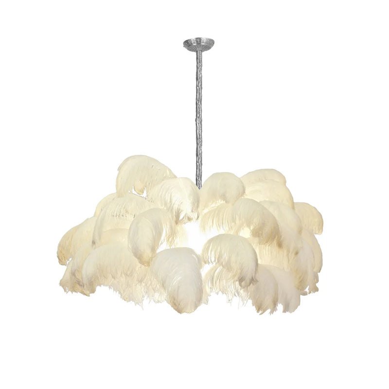 Cream-white feathers surround the lamp on this Clérachic chandelier, hung from a silver-finish stem on a white backdrop.