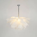 White feathers glow softly on this Clérachic chandelier, which has a silver-finish stem and a round ceiling cup.