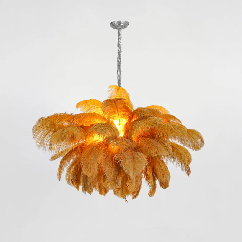 Amber-orange feathers glow around the centre of this Clérachic chandelier, hung from a silver-finish stem on soft grey.