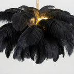 Another close crop of this Clérachic chandelier, black plumes layered thick around a glowing centre.