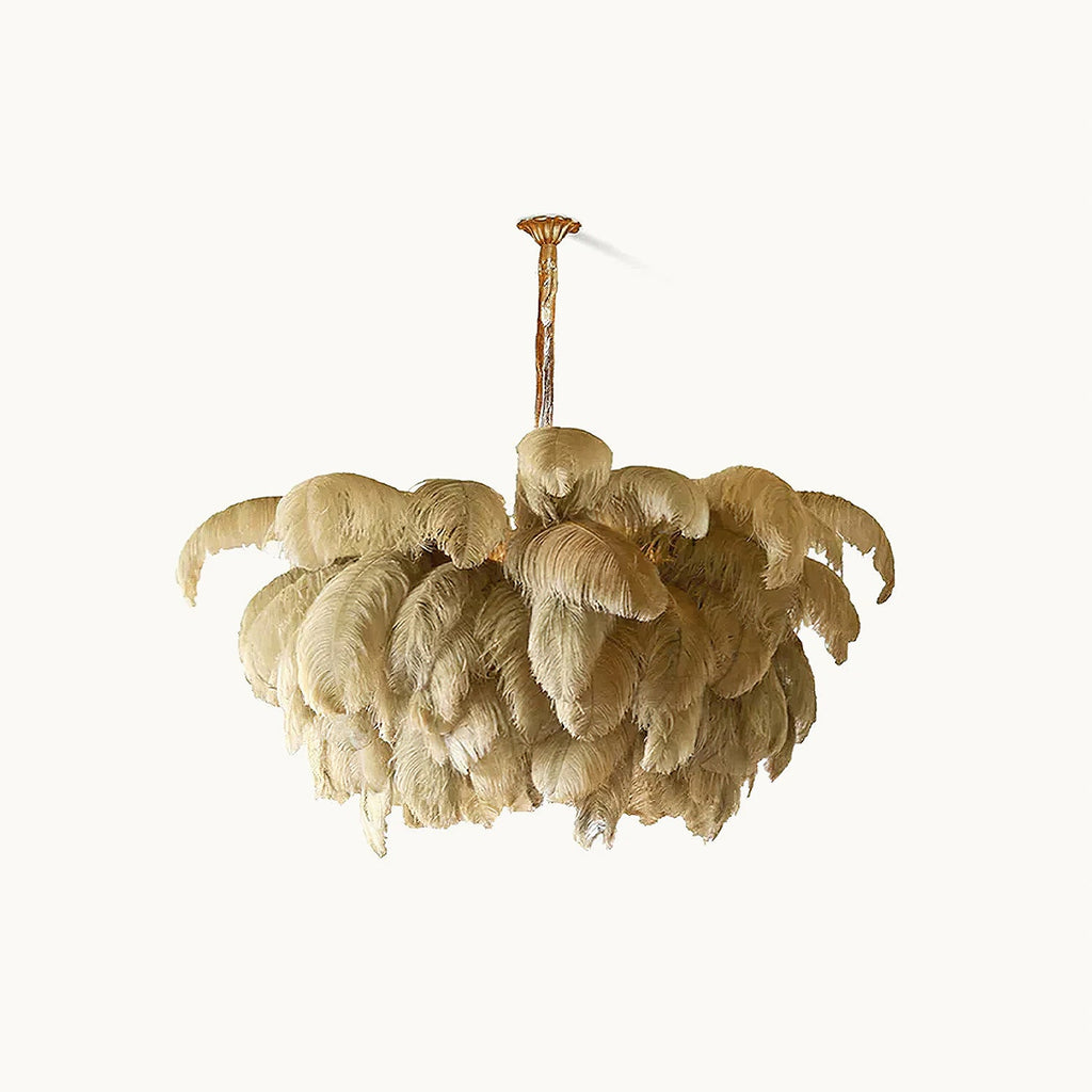 Natural sandy feathers layered like petals on this Clérachic chandelier, on a soft off-white backdrop.
