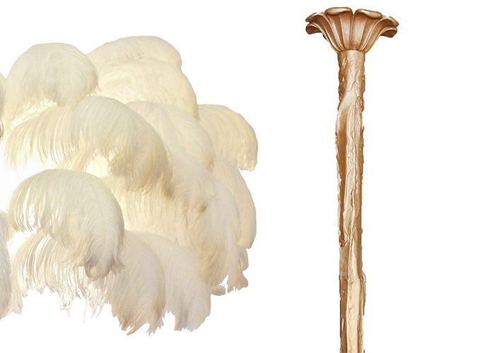 Swatch of cream ostrich feathers beside the brass-finish stem and ceiling cup of this Clérachic chandelier.