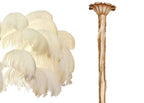 Swatch of cream ostrich feathers beside the brass-finish stem and ceiling cup of this Clérachic chandelier.