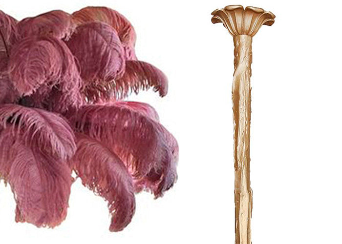Swatch of raspberry-pink ostrich feathers beside the brass-finish stem and ceiling cup of this Clérachic chandelier.