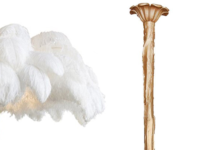 A cut-out of white plumes paired with the brass-finish stem option, for this Clérachic chandelier.