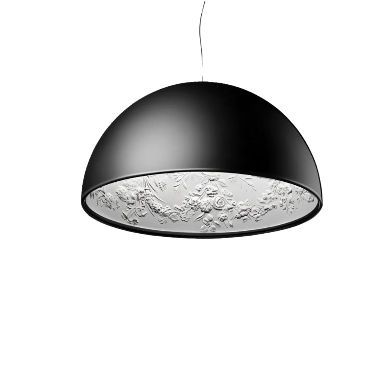 Clérachic matte black dome pendant light on white, its white interior moulded with a detailed floral garland.