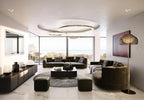 Gold rings hang over a recessed round ceiling panel in a living room with olive velvet sofas and a sea view, lit by this Clérachic pendant.