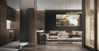Gold rings hang over an open dark-timber kitchen and lounge with a cream sofa and a large painting, seen in a wide room view with this Clérachic pendant.