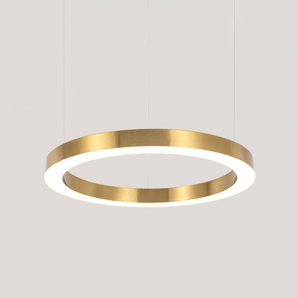 The largest single gold ring in close crop, its brushed edge and white diffuser lit, on pale grey, from Clérachic.
