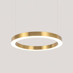 The largest single gold ring in close crop, its brushed edge and white diffuser lit, on pale grey, from Clérachic.