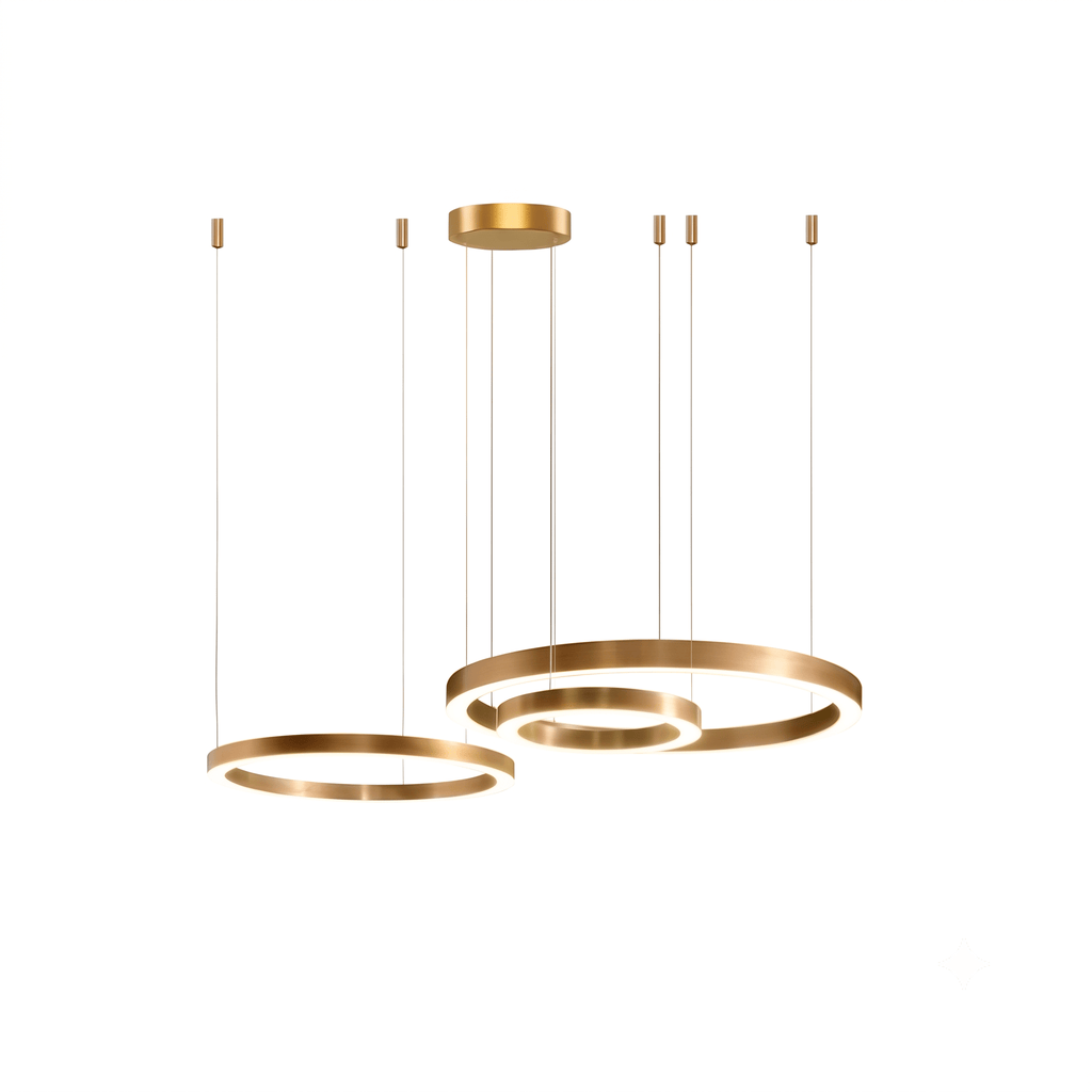 Two brushed gold rings hang from a round canopy on thin cables against white, one ring nested inside a larger one, from Clérachic.