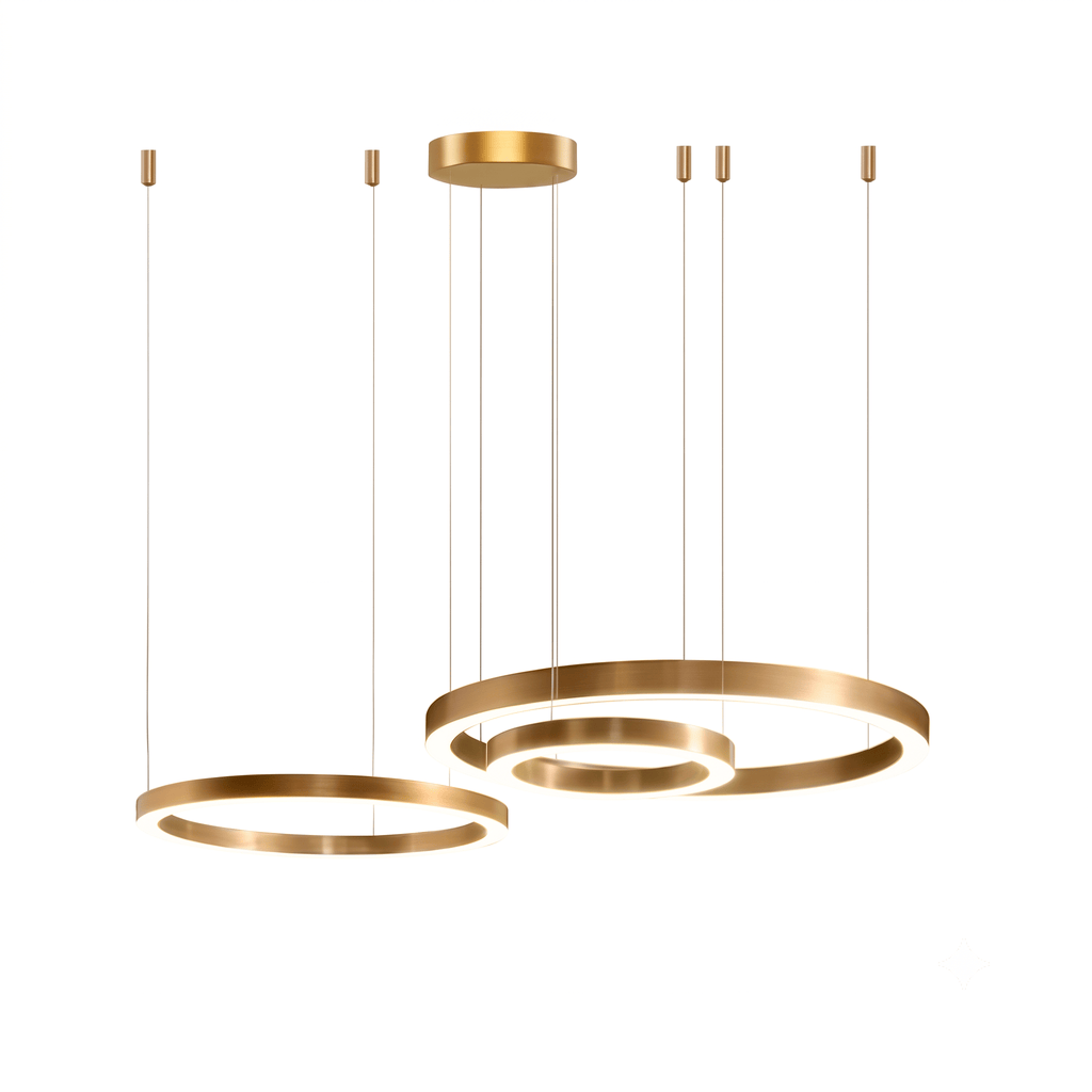 Larger view of two gold rings hanging from a round brass canopy on thin cables, one ring partly inside the other, a Clérachic pendant.