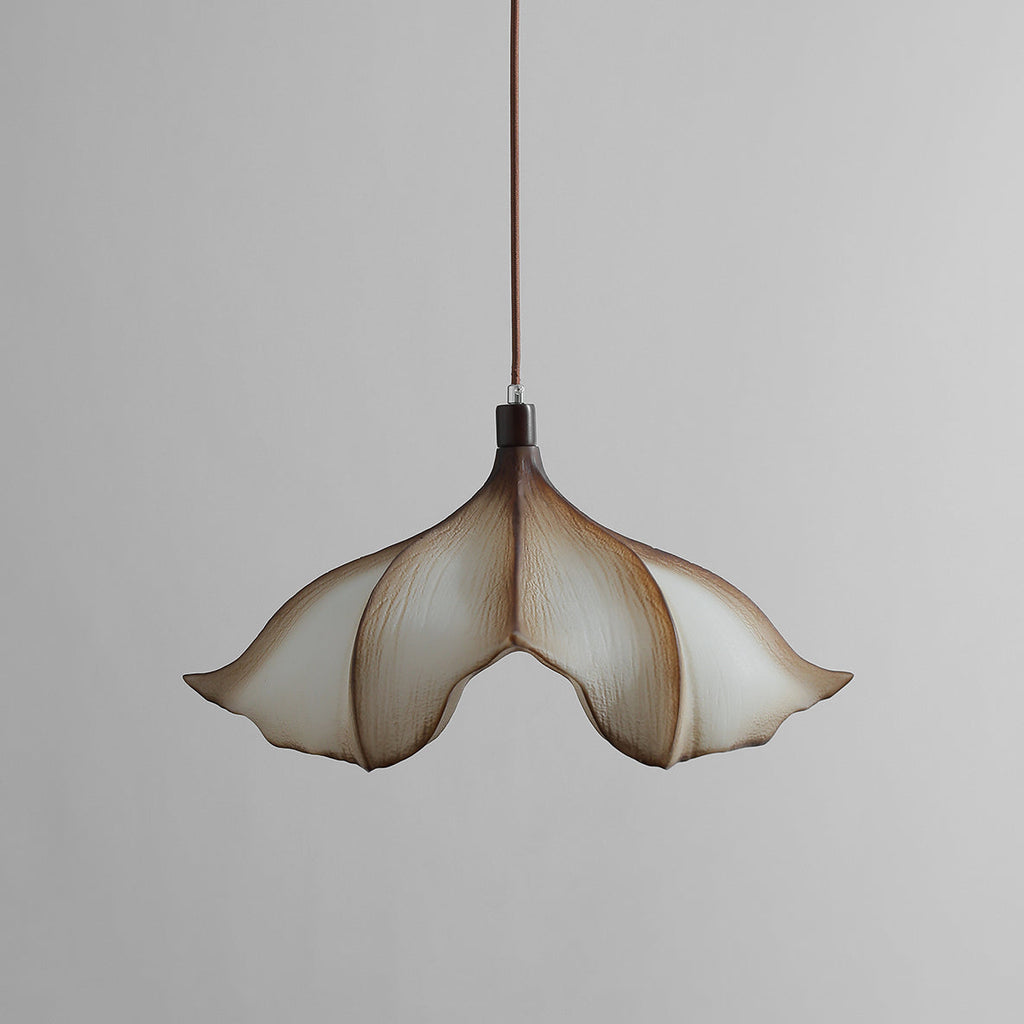 Clérachic petal pendant on a grey backdrop, unlit, seen from slightly below with its cream shade and brown edges.
