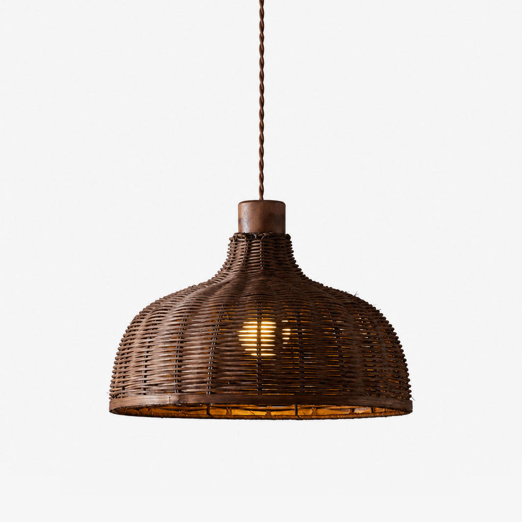 Close view of the rattan weave and exposed bulb on this Clérachic pendant, shot against a plain backdrop.