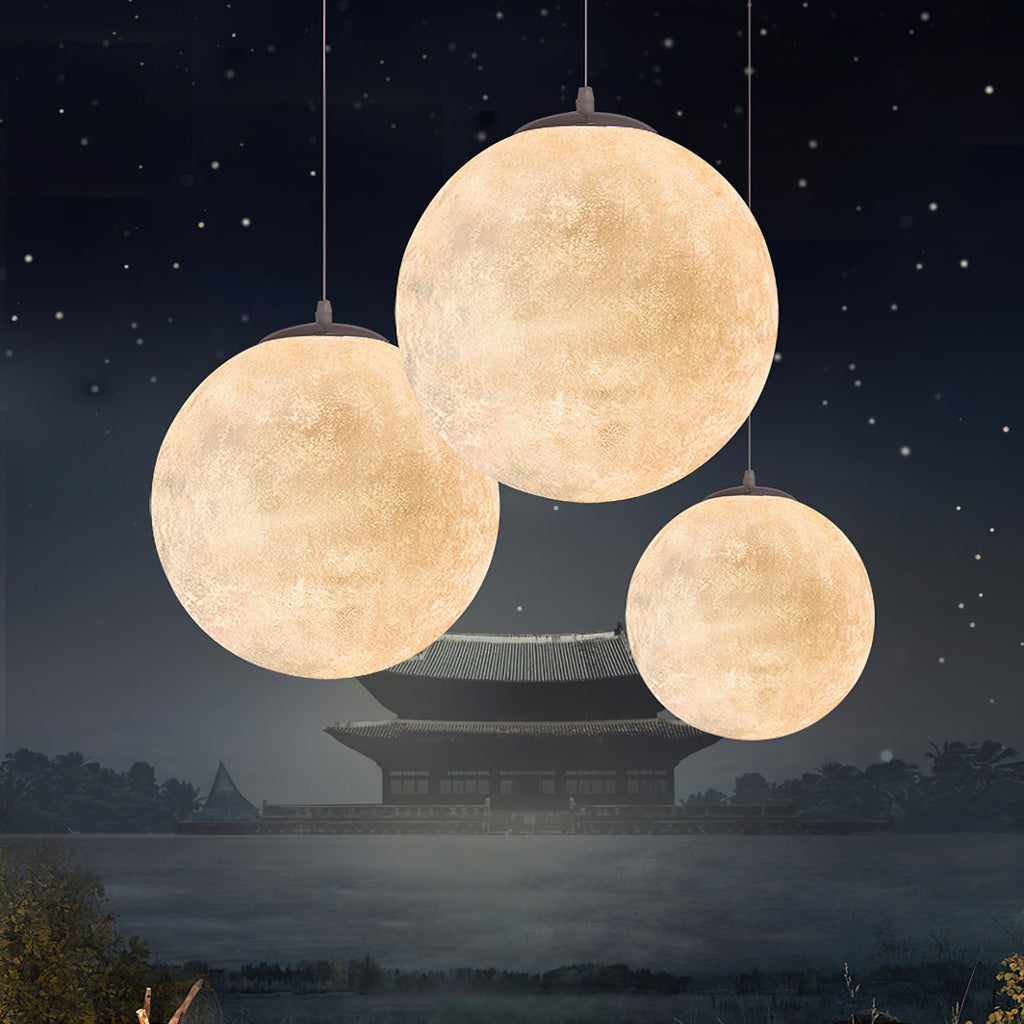 Three Clérachic spheres of different sizes hang like moons in a night scene of stars, still water and a distant pavilion.
