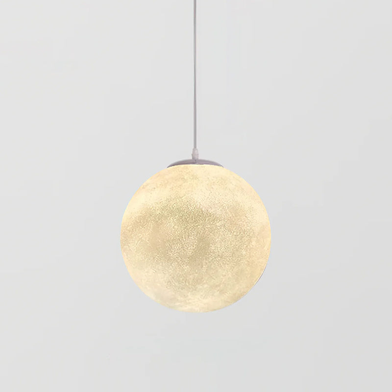 A mid-small Clérachic sphere pendant, lit, with a grey canopy and a fine cord, set against a plain light grey backdrop.