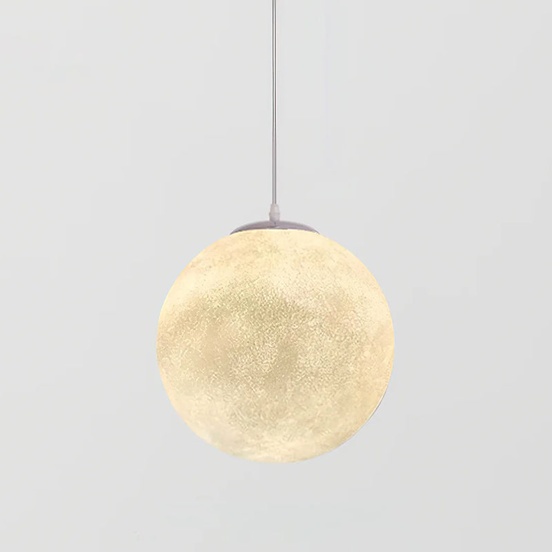 A large lit Clérachic sphere pendant with a pale crater texture and grey canopy, framed against a light grey backdrop.