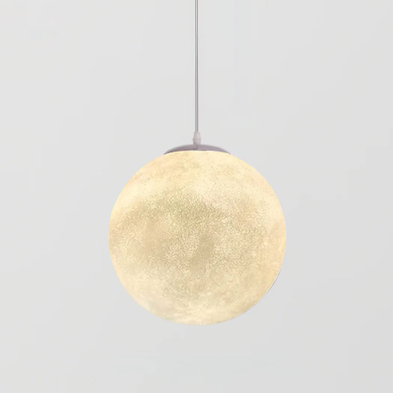 One of the bigger Clérachic sphere pendants, glowing warm cream, almost filling the frame on a light grey backdrop.