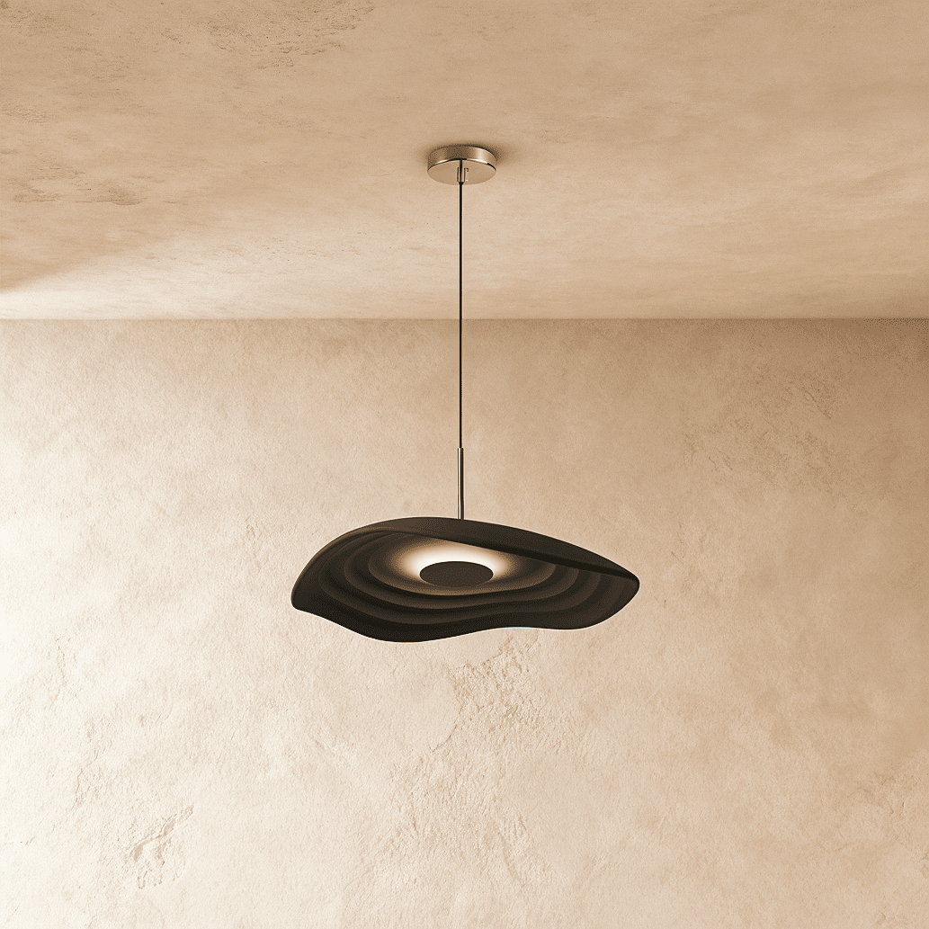 Clérachic rippled resin pendant in deep charcoal with a glowing centre, on a slim rod and cord by a plaster wall