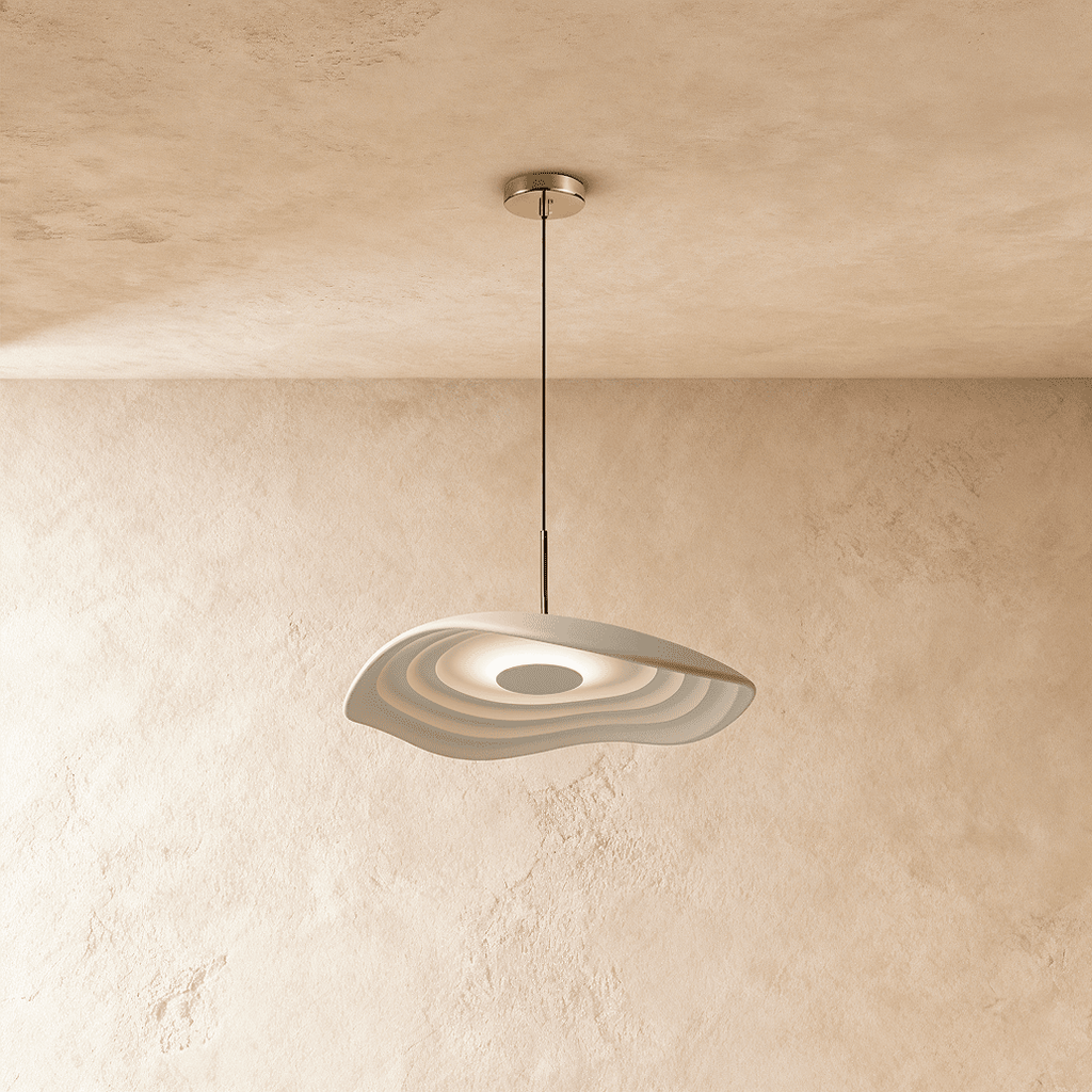 Clérachic rippling resin pendant in white, lit softly from within, hanging from a chrome canopy by plaster walls