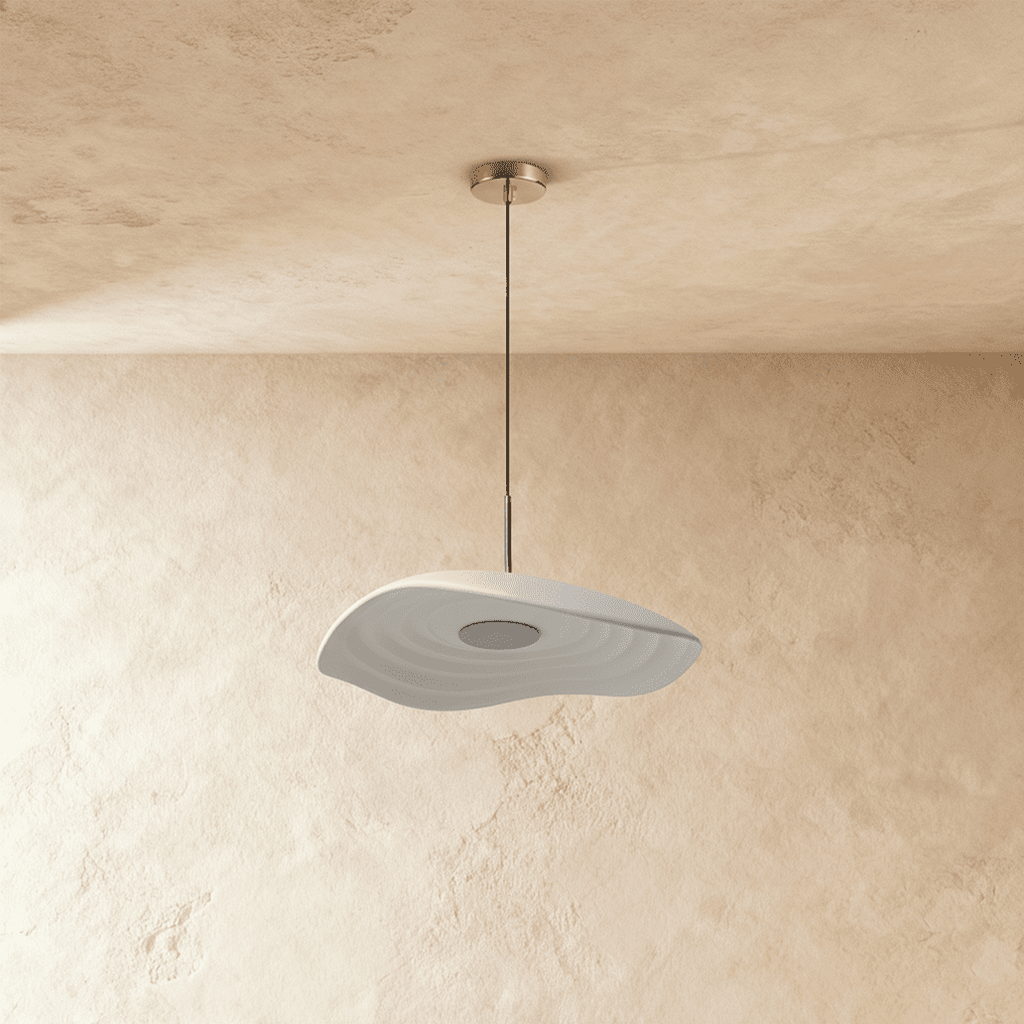 Clérachic wavy white resin pendant with fine concentric ripples, unlit, hung from a chrome canopy on a plaster wall