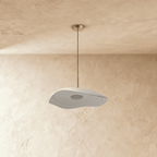 Clérachic wavy white resin pendant with fine concentric ripples, unlit, hung from a chrome canopy on a plaster wall