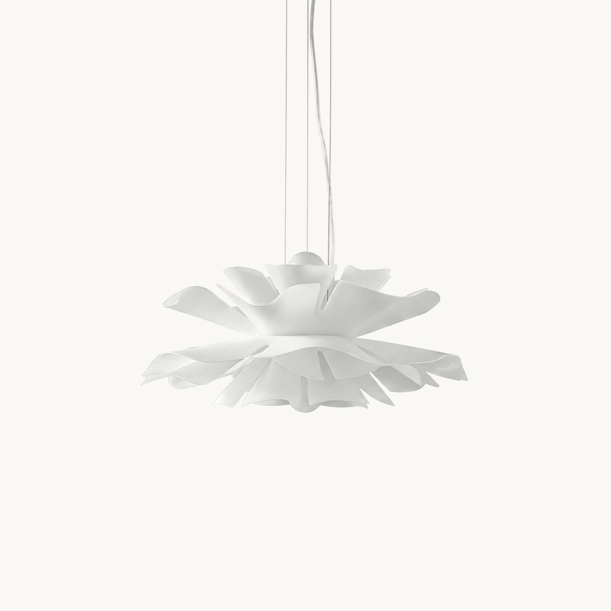 Clérachic pendant with layered white acrylic petals forming a lotus shape, hung on slim cables against a plain white backdrop.