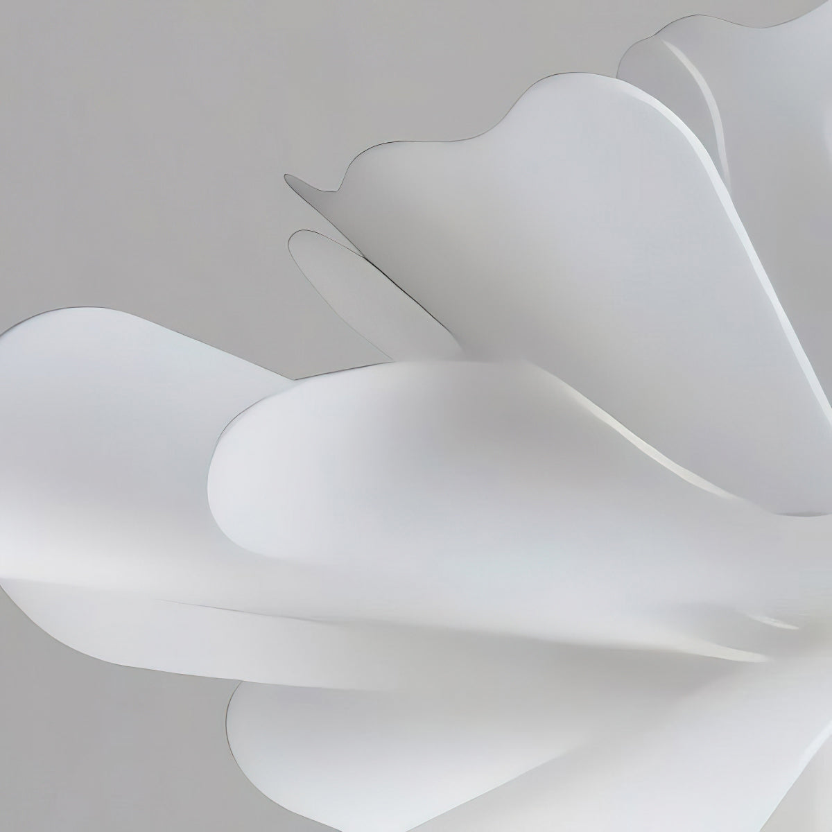 Close view of the smooth, curved white acrylic petals on this Clérachic pendant.