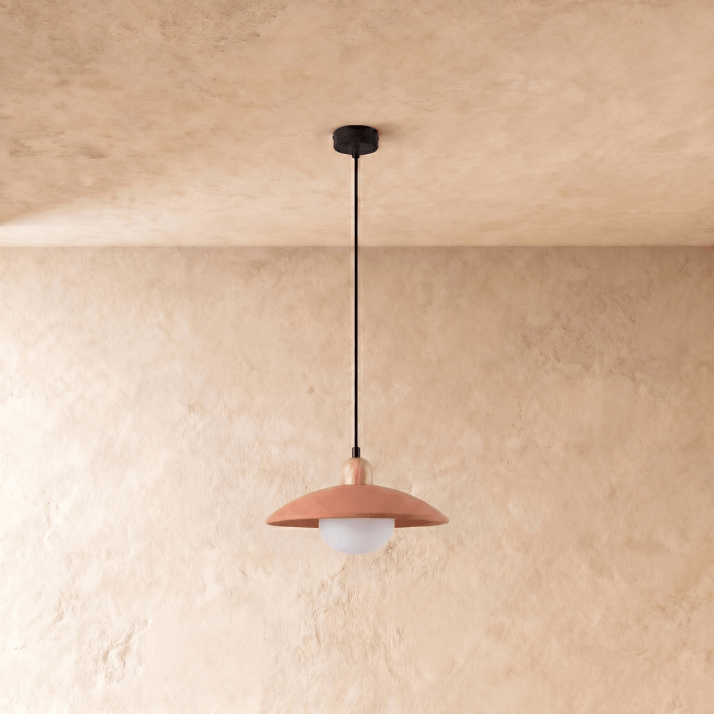 Clérachic pendant light in orange, the saucer shade and globe diffuser viewed from a slightly different angle.