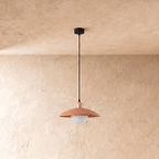 Clérachic pendant light in orange, the saucer shade and globe diffuser viewed from a slightly different angle.