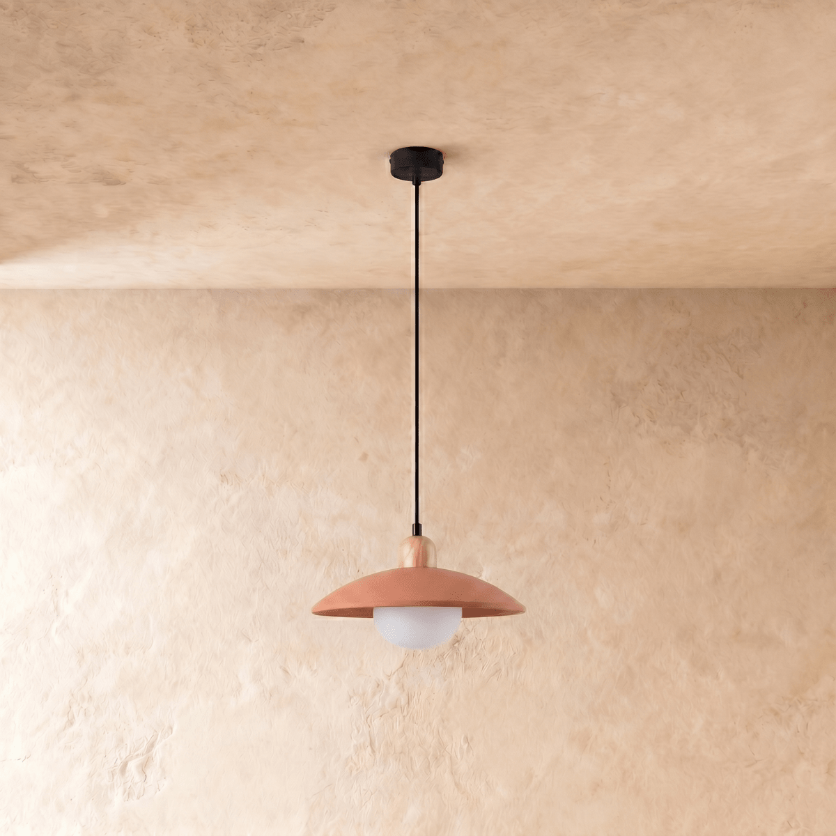 Clérachic pendant light in orange, the saucer shade and globe diffuser viewed from a slightly different angle.