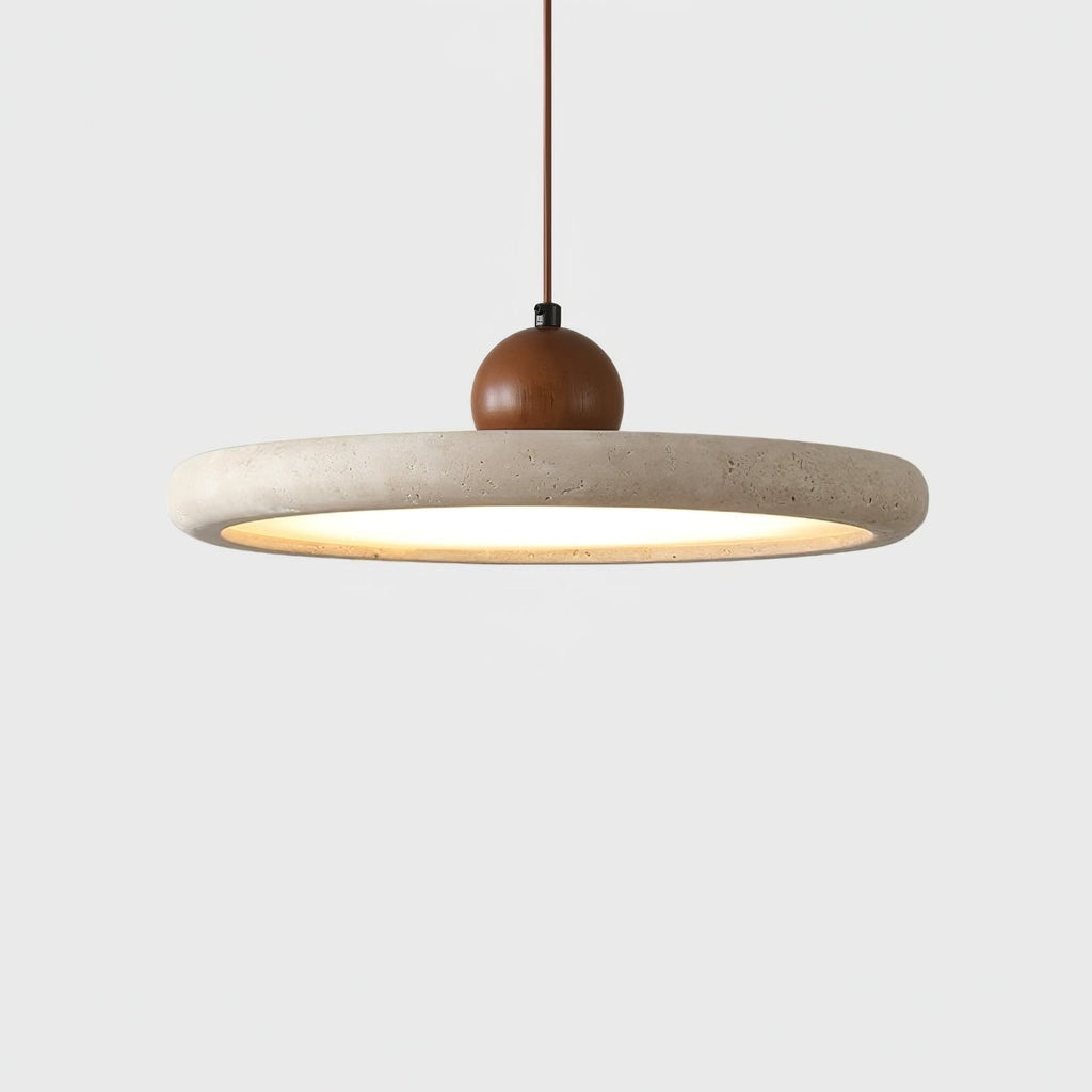 Close side view of the thick pale stone-look rim, walnut-toned wooden bead and warm underlight of this Clérachic pendant, on white.