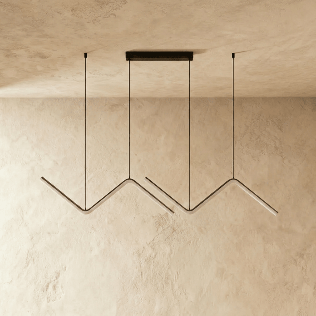 Clérachic black double zig-zag LED pendant shown unlit, with the pale diffuser strips along each bar, on plaster.