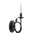 The Clérachic sconce in matte black, candle-style bulb resting unlit, captured from a slightly different angle on white.