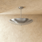 Clérachic perforated disc pendant light in chrome, shown from a slightly closer studio angle overhead.