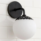 Single-head Clérachic Petal-Cap Opal Globe Wall Sconce in oil-rubbed black against white square tile.