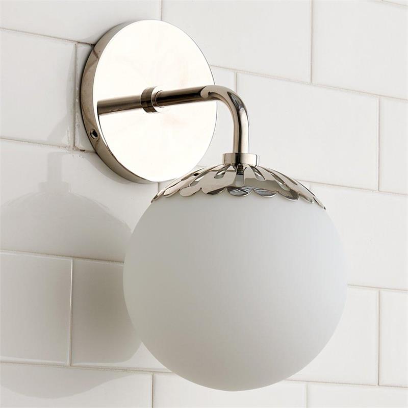 Clérachic Petal-Cap Opal Globe Wall Sconce in polished nickel, one head, the backplate mirroring the tile behind it.