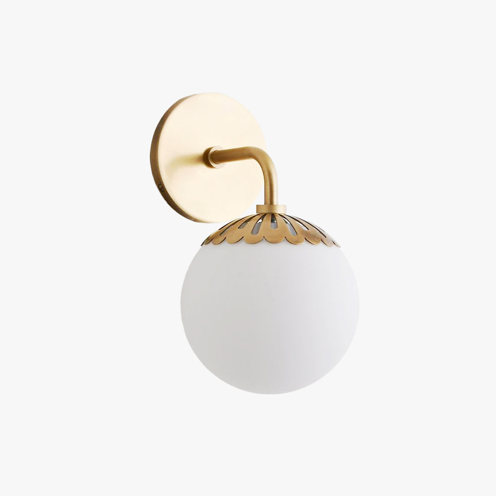 Side profile of the brass Clérachic Petal-Cap Opal Globe Wall Sconce on an off-white studio backdrop.