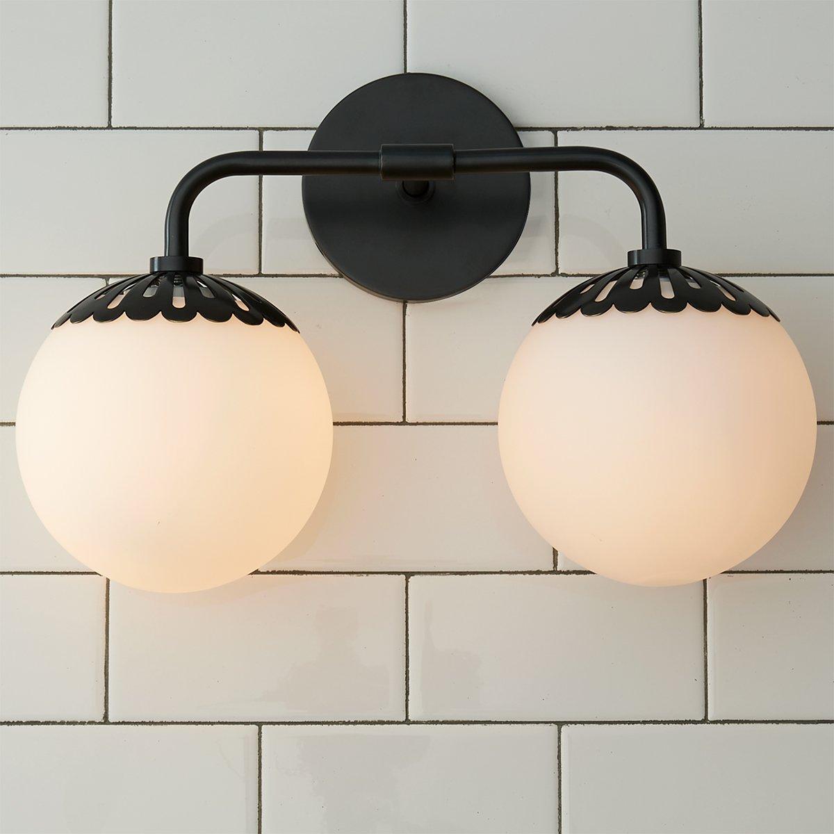 Two-head black Clérachic Petal-Cap Opal Globe Wall Sconce head-on, globes level either side of the backplate.