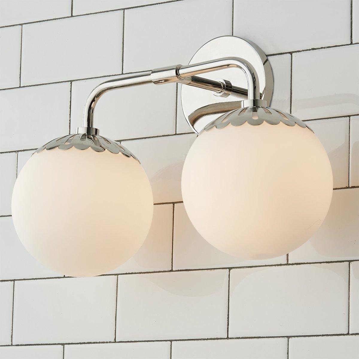 Two-head nickel Clérachic Petal-Cap Opal Globe Wall Sconce angled, the arm catching a bright highlight.