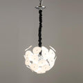 Clérachic Petal Sphere Chandelier with frosted glass discs on a chrome frame, unlit against a grey backdrop.