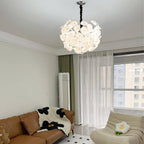 Unlit Clérachic Petal Sphere Chandelier on a plain white background, showing its full round silhouette.