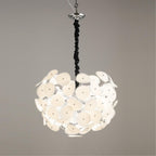 Close-up of the Clérachic Petal Sphere Chandelier's glass petals, each rimmed in polished clear edging.