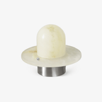 Clérachic Petrified table lamp on white, alabaster dome seated on a stone disc and metal base.
