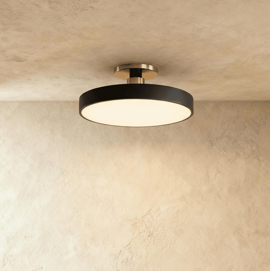 Clérachic ceiling light in matte black, the round drum shade mounted close to the ceiling on a nickel stem.
