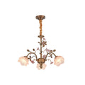 Clérachic chandelier with a fabric-wrapped chain on a white backdrop, ceramic roses in soft pink and frosted glass rose shades lit.