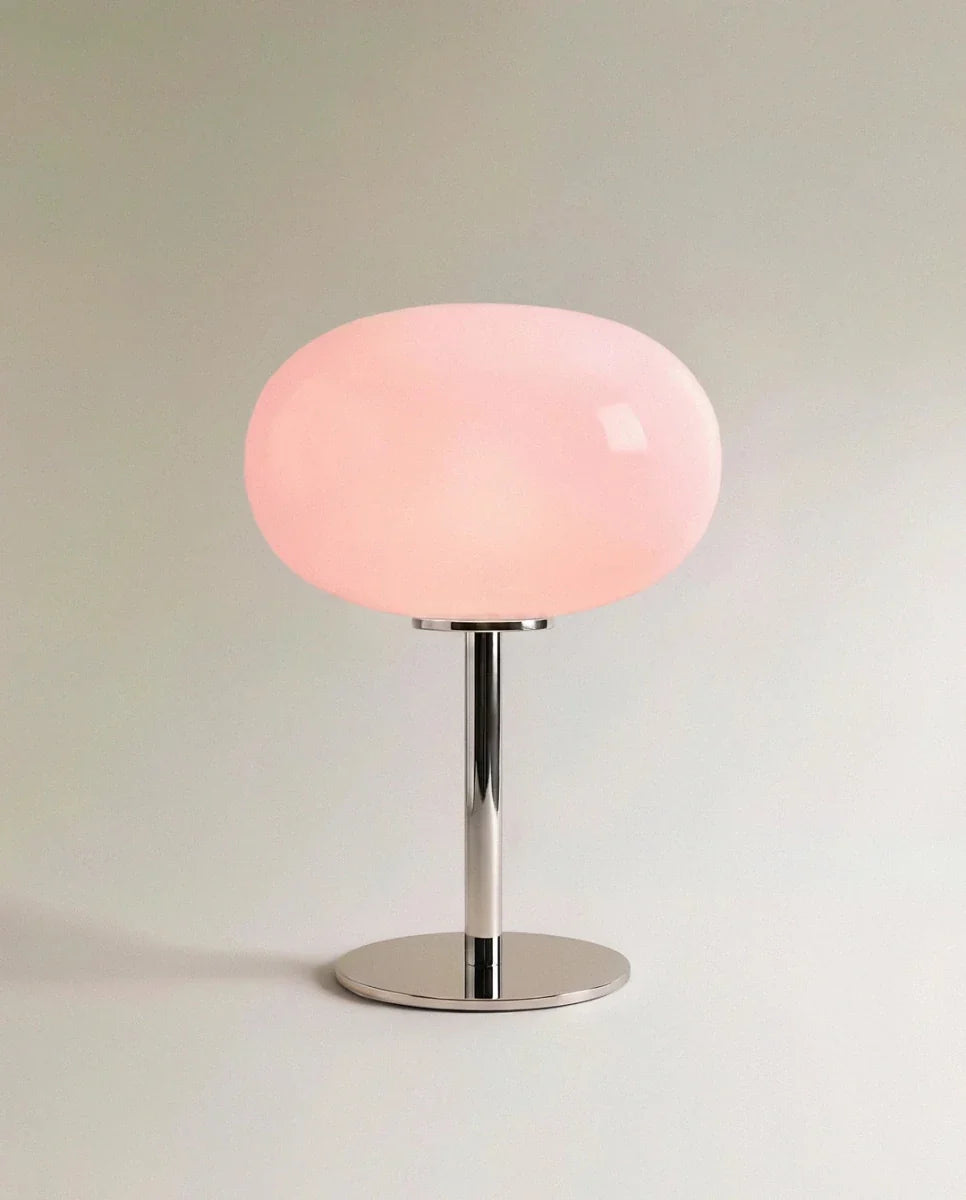Clérachic opal glass table lamp with a blush pink globe shade on a polished chrome pedestal base.