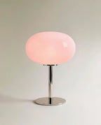 Clérachic opal glass table lamp with a blush pink globe shade on a polished chrome pedestal base.